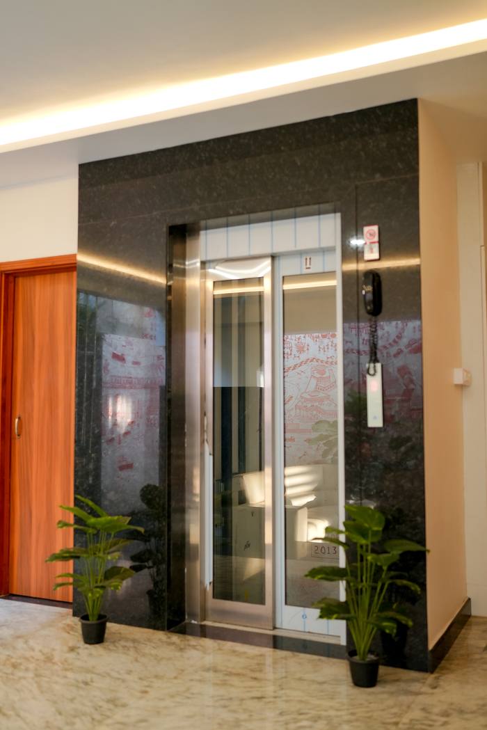 Lobby and elevator at Legacy Square Hotel